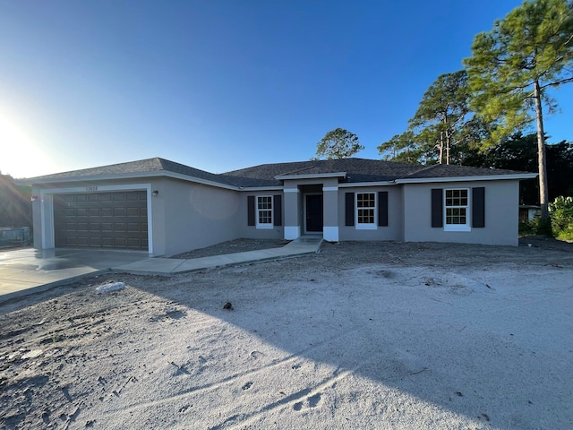 single story home featuring a garage