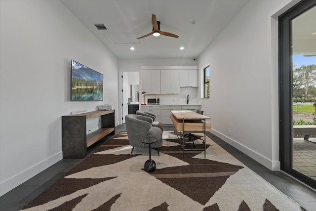 office with a wealth of natural light, ceiling fan, and sink