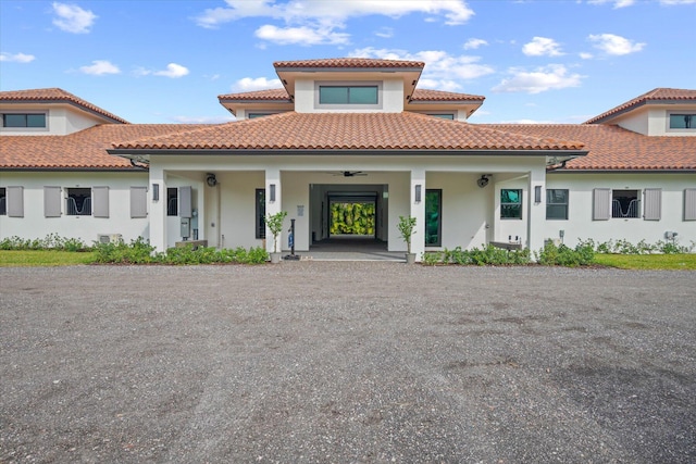 mediterranean / spanish home with a porch