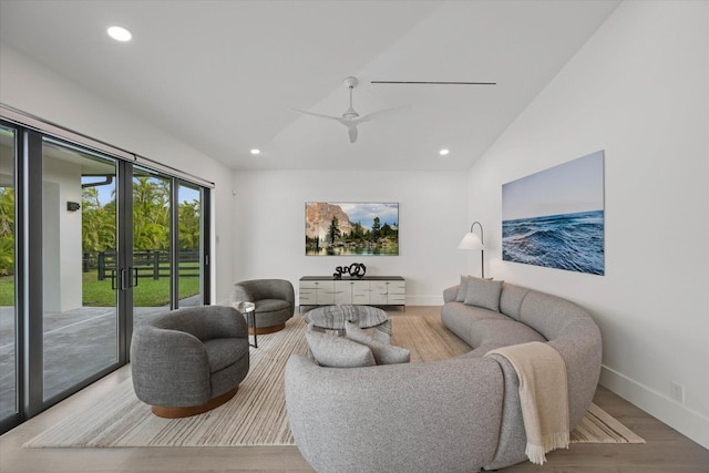 living room featuring french doors, ceiling fan, wood-type flooring, and vaulted ceiling