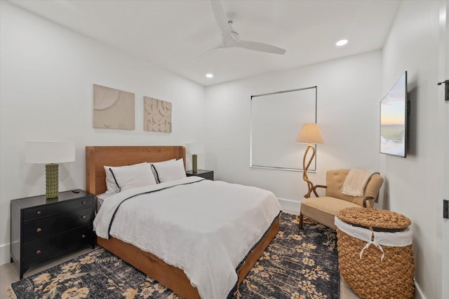 bedroom with ceiling fan and hardwood / wood-style floors