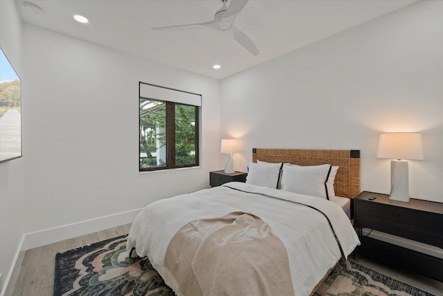 bedroom featuring ceiling fan and wood-type flooring