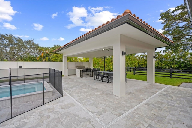 view of patio / terrace featuring ceiling fan