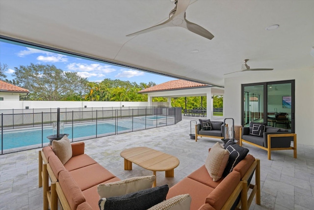 view of patio featuring a fenced in pool, an outdoor hangout area, and ceiling fan