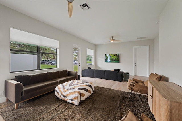 living room with hardwood / wood-style floors and ceiling fan