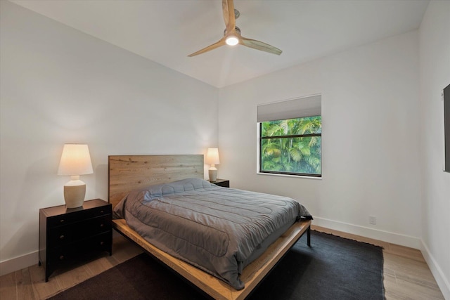 bedroom with ceiling fan and light hardwood / wood-style floors