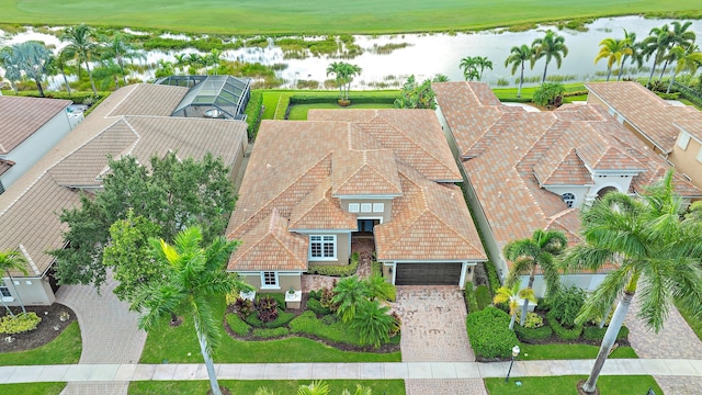 birds eye view of property featuring a water view