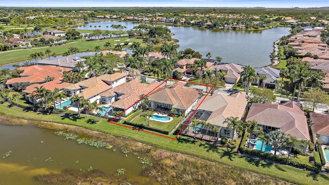 birds eye view of property with a residential view and a water view