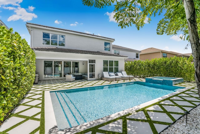 view of pool featuring a patio, an in ground hot tub, and an outdoor living space