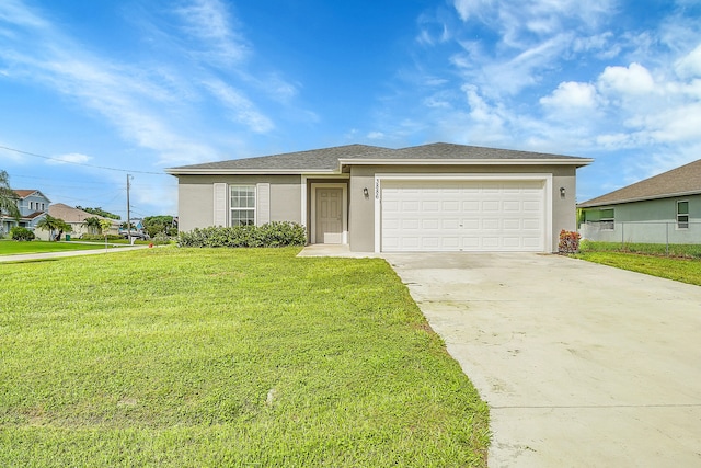 view of front of home featuring a front yard and a garage