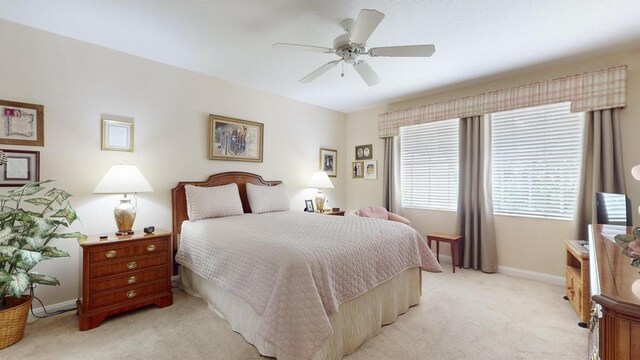 carpeted bedroom with ceiling fan