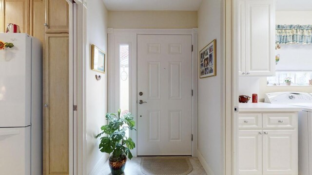 entrance foyer featuring washer / dryer