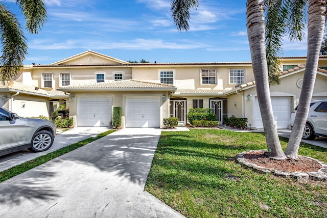 view of front of house featuring a front yard and a garage