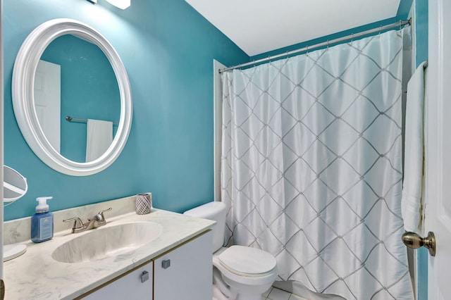 bathroom featuring vanity, toilet, and walk in shower