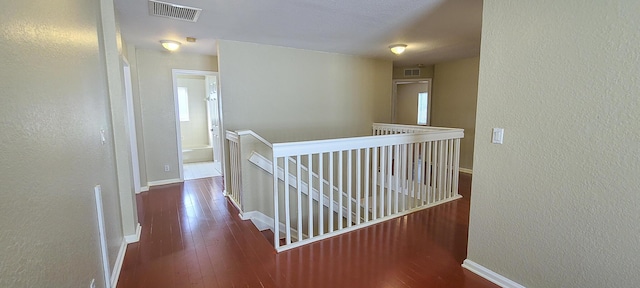 hall with dark hardwood / wood-style floors