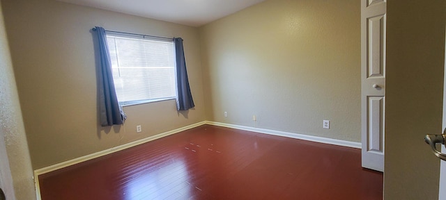 empty room with wood-type flooring