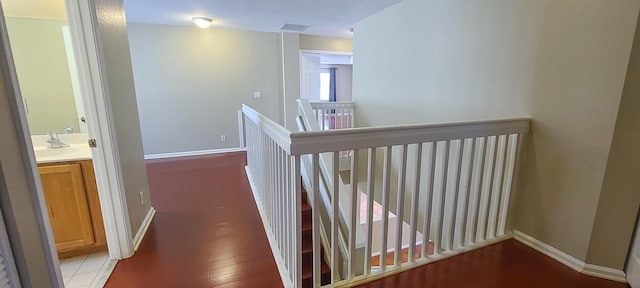 hall featuring light hardwood / wood-style flooring and sink