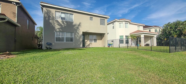 back of house with a yard