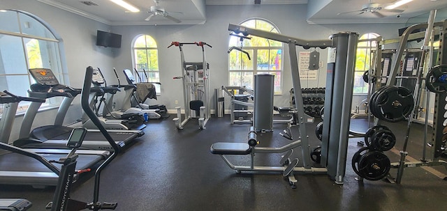 exercise room with crown molding and ceiling fan