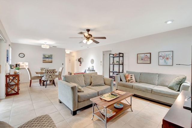 tiled living room featuring ceiling fan