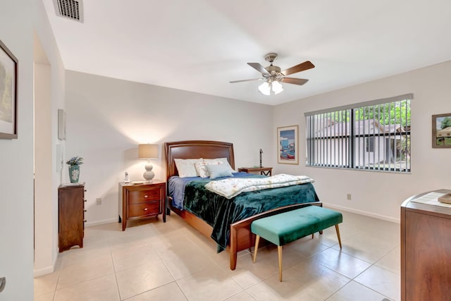 tiled bedroom featuring ceiling fan