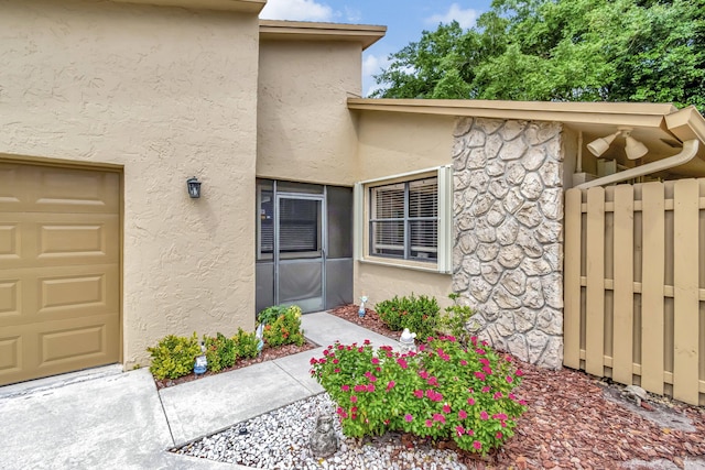 entrance to property featuring a garage