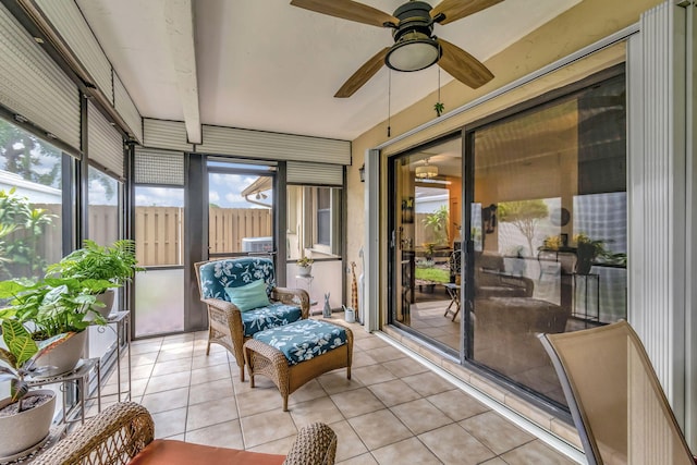 sunroom featuring ceiling fan