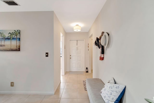 foyer featuring light tile patterned floors