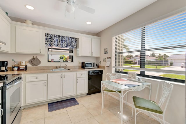 kitchen featuring white cabinets, a wealth of natural light, black dishwasher, and sink