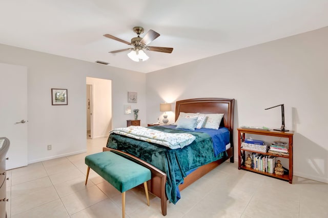 tiled bedroom with ceiling fan