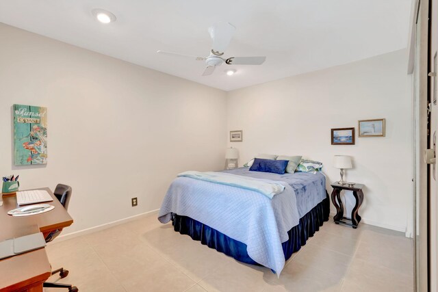 tiled bedroom with ceiling fan