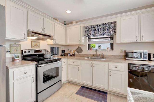 kitchen with white cabinetry, light tile patterned flooring, stainless steel appliances, and sink