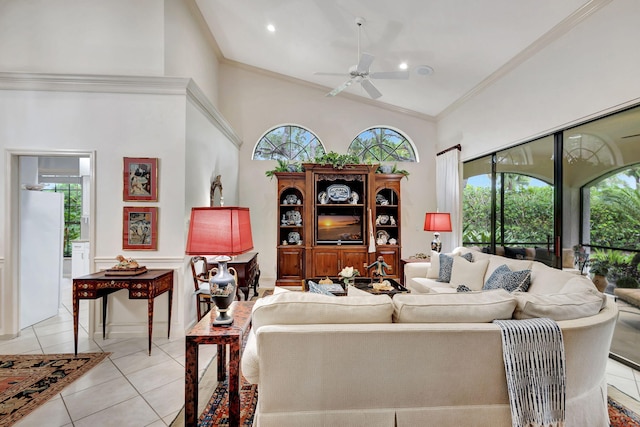 tiled living room featuring ornamental molding, ceiling fan, and a healthy amount of sunlight