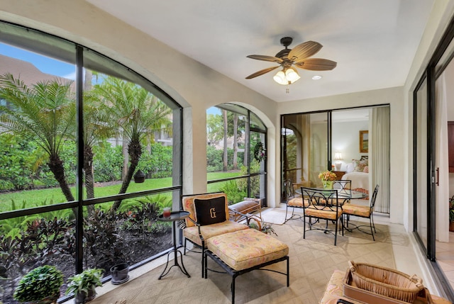 sunroom / solarium with ceiling fan