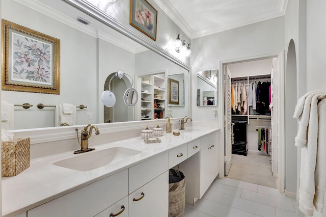 bathroom featuring ornamental molding, tile patterned floors, and vanity