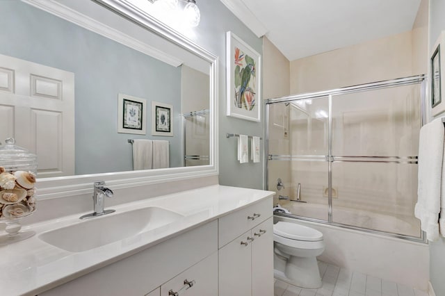 full bathroom with vanity, ornamental molding, combined bath / shower with glass door, tile patterned floors, and toilet