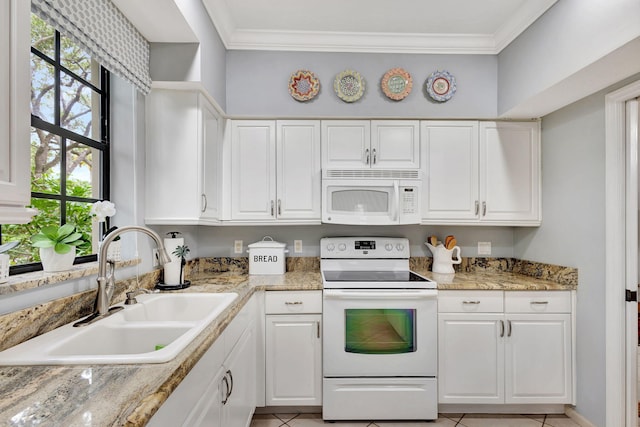 kitchen with light tile patterned floors, sink, white appliances, white cabinetry, and crown molding