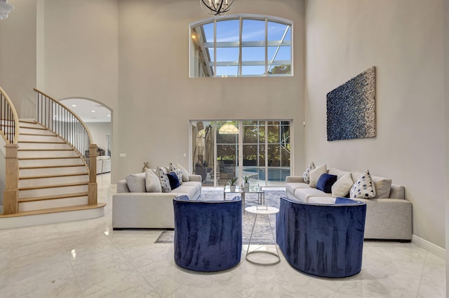 living room featuring a towering ceiling