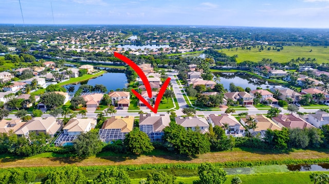 birds eye view of property featuring a water view