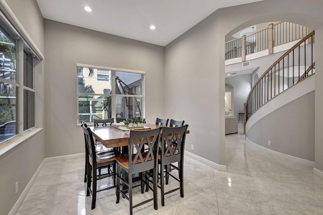 dining area with vaulted ceiling and a wealth of natural light