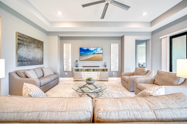 living room with plenty of natural light and ceiling fan