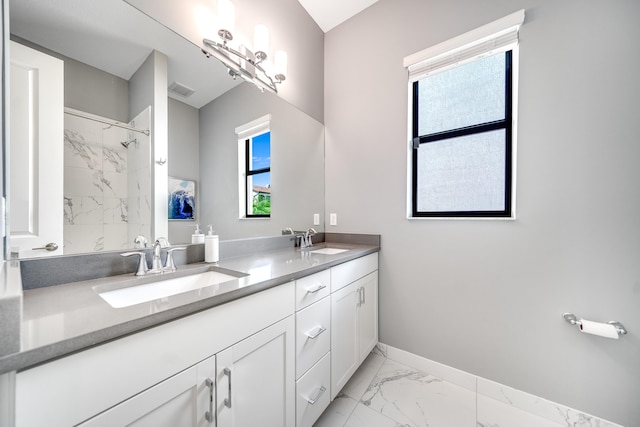 bathroom featuring vanity and a tile shower