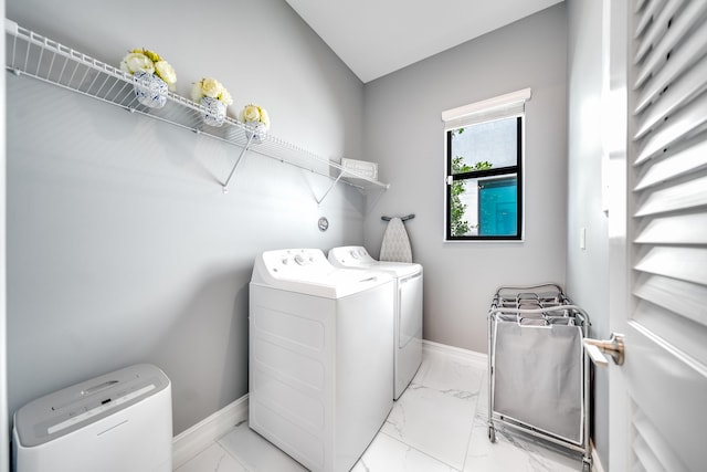 laundry room featuring washer and clothes dryer