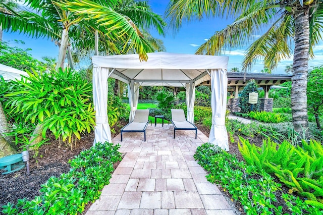 view of patio / terrace with a water view and a gazebo