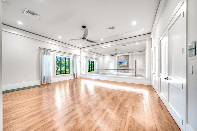 unfurnished living room featuring ceiling fan and wood-type flooring