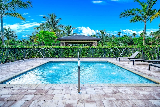 view of swimming pool featuring pool water feature