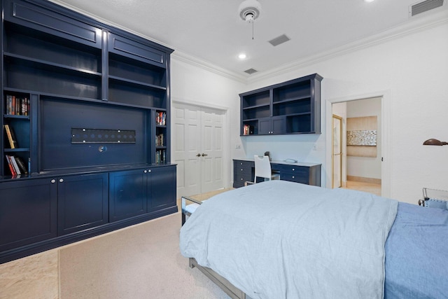 bedroom with light carpet, a closet, crown molding, ensuite bath, and ceiling fan