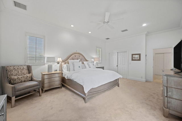 bedroom with a closet, ceiling fan, crown molding, and light carpet