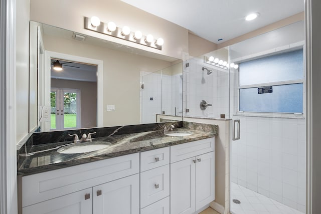 bathroom with ceiling fan, vanity, and an enclosed shower