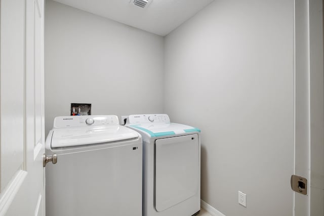 laundry room featuring washing machine and dryer